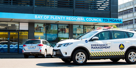 Civil Defence car in front of building