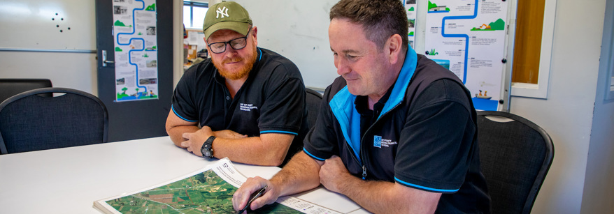 Two men looking at a map