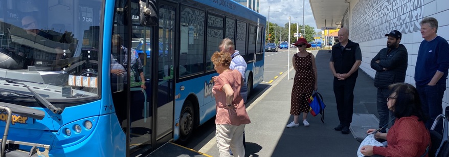 People at a bus stop